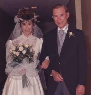bride and her father about to walk down the aisle