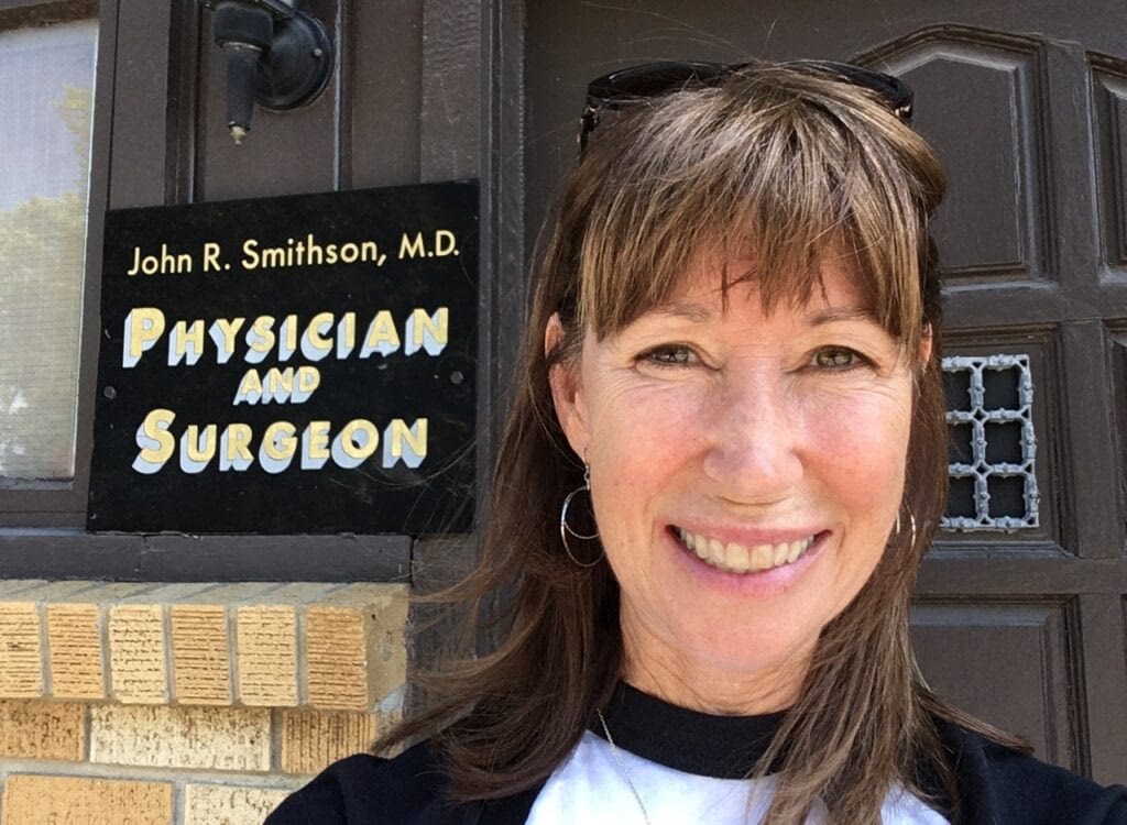 girl by physician sign