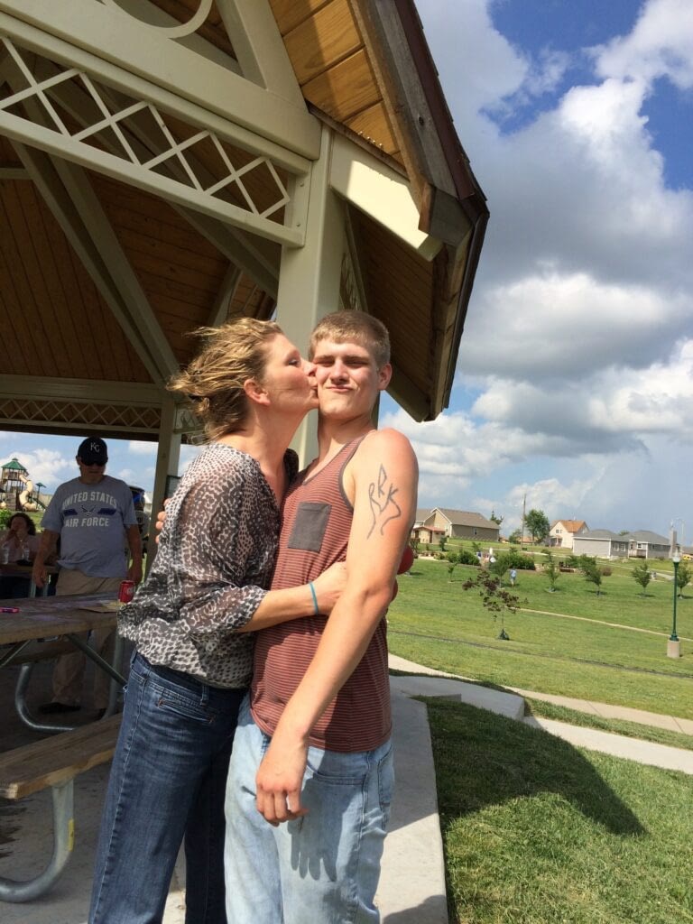 mom kissing son
